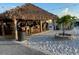 Outdoor tiki hut with sandy flooring for resort style dining at 949 Springview Nw Ave, Port Charlotte, FL 33948