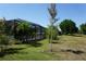 The home boasts a lush green backyard and lovely screened-in lanai perfect for Florida living at 98 Valdiva St, Punta Gorda, FL 33983