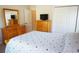 Cozy bedroom featuring matching wooden furniture and a queen bed at 98 Valdiva St, Punta Gorda, FL 33983
