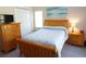 Bedroom with bed, dresser, and TV at 98 Valdiva St, Punta Gorda, FL 33983