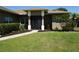 Inviting front entrance with a well-kept lawn and a beautifully landscaped walkway at 98 Valdiva St, Punta Gorda, FL 33983