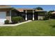 Charming home with well-maintained lawn, lush landscaping, and inviting entry at 98 Valdiva St, Punta Gorda, FL 33983