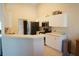 Bright kitchen featuring white cabinets, stainless steel appliances, and an open counter space at 98 Valdiva St, Punta Gorda, FL 33983