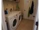 Bright laundry room featuring front-loading washer and dryer at 98 Valdiva St, Punta Gorda, FL 33983