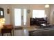 Comfortable living room featuring neutral tones, stylish furniture, and a view of the front door at 98 Valdiva St, Punta Gorda, FL 33983