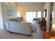 Open-concept living area with sliding glass doors and view to a dining area at 98 Valdiva St, Punta Gorda, FL 33983