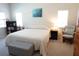Comfortable main bedroom featuring natural light, carpeted floor, and a relaxing reading nook at 98 Valdiva St, Punta Gorda, FL 33983