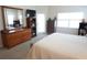 Comfortable main bedroom featuring natural light, carpeted floor, and a relaxing reading nook at 98 Valdiva St, Punta Gorda, FL 33983