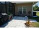 Outdoor patio area with grill, seating, and mature landscaping, perfect for entertaining guests at 98 Valdiva St, Punta Gorda, FL 33983