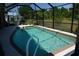Refreshing pool with screened enclosure, offering privacy and bug-free enjoyment at 98 Valdiva St, Punta Gorda, FL 33983