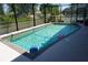Sparkling pool with toys, surrounded by a screened enclosure, offering a private retreat at 98 Valdiva St, Punta Gorda, FL 33983