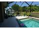 Inviting pool with plants and screened-in enclosure offers a relaxing backyard oasis at 98 Valdiva St, Punta Gorda, FL 33983