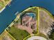 Gorgeous waterfront home, boasting a private dock, screened lanai, and lush landscaping at 10580 Poughkeepsie Cir, Port Charlotte, FL 33981