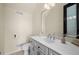 Stylish half bathroom with vanity, neutral color palette, and modern fixtures at 10580 Poughkeepsie Cir, Port Charlotte, FL 33981