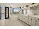 A luxurious bathroom offers a soaking tub, double vanity, and access to the lanai at 10580 Poughkeepsie Cir, Port Charlotte, FL 33981
