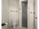 Neutral bathroom with a toilet, dark hardware, and walk-in shower with glass door at 10580 Poughkeepsie Cir, Port Charlotte, FL 33981