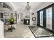 Grand foyer featuring tile floors, soaring ceilings, decorative columns, and elegant lighting fixtures at 10580 Poughkeepsie Cir, Port Charlotte, FL 33981