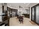 Well-equipped kitchen with an island, stainless steel appliances, and adjacent breakfast nook at 10580 Poughkeepsie Cir, Port Charlotte, FL 33981