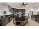 Beautiful kitchen featuring an island, modern appliances, granite countertops, and tile floors at 10580 Poughkeepsie Cir, Port Charlotte, FL 33981