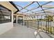 Screened-in lanai featuring a pool and lovely lake views, offering an outdoor oasis for relaxation and entertaining at 10580 Poughkeepsie Cir, Port Charlotte, FL 33981