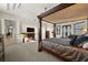 Tranquil main bedroom features a fireplace and access to the outdoor patio, promoting a relaxing ambiance at 10580 Poughkeepsie Cir, Port Charlotte, FL 33981