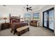 Bright main bedroom boasts a seating area, en-suite bath, and access to the lanai at 10580 Poughkeepsie Cir, Port Charlotte, FL 33981