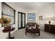 Cozy sitting area with comfortable furnishings and abundant natural light, ideal for relaxation or reading at 10580 Poughkeepsie Cir, Port Charlotte, FL 33981