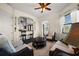 Cozy sitting room with comfortable seating and open view to the adjacent kitchen and dining area at 10580 Poughkeepsie Cir, Port Charlotte, FL 33981