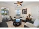 Comfortable sitting room with plush seating, a large window, and a view of the pool at 10580 Poughkeepsie Cir, Port Charlotte, FL 33981