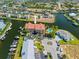 Aerial view of waterfront complex with a pool, docks, and boat access at 1326 Wesley Dr # 132, Punta Gorda, FL 33950