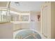 Bright bathroom featuring double sinks, vanity, and walk-in tub, accented by decorative starfish at 1326 Wesley Dr # 132, Punta Gorda, FL 33950