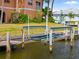 Close up of a boat lift with seawall and green grass at 1326 Wesley Dr # 132, Punta Gorda, FL 33950