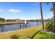 Boat lift on a grassy lawn with canal views at 1326 Wesley Dr # 132, Punta Gorda, FL 33950