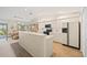 Open-concept kitchen with white cabinetry, stainless-steel appliances, and eat-in dining area at 1326 Wesley Dr # 132, Punta Gorda, FL 33950