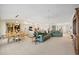 Spacious, open-concept design seamlessly connects the dining room, living room, and kitchen for easy living at 1326 Wesley Dr # 132, Punta Gorda, FL 33950