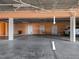 Brightly lit parking garage with assigned spots and storage lockers at 1326 Wesley Dr # 132, Punta Gorda, FL 33950