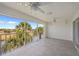 Screened patio offers outdoor living space with fans and waterfront views at 1326 Wesley Dr # 132, Punta Gorda, FL 33950
