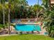 Lush tropical landscaping surrounds this pool and spa creating a private retreat at 1326 Wesley Dr # 132, Punta Gorda, FL 33950