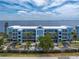 Stunning aerial view of blue buildings by the water, surrounded by lush greenery at 1750 Jamaica Way # 312, Punta Gorda, FL 33950