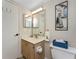 Bathroom with updated fixtures, sailboat art, and neutral finishes at 1750 Jamaica Way # 312, Punta Gorda, FL 33950