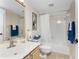 Well-lit bathroom featuring a shower/tub combo and nautical-themed decor at 1750 Jamaica Way # 312, Punta Gorda, FL 33950