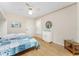 Bedroom featuring wood flooring, neutral walls, and white ceiling fan at 1750 Jamaica Way # 312, Punta Gorda, FL 33950