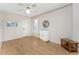 Bright bedroom with wood floors, ceiling fan, and modern furnishings at 1750 Jamaica Way # 312, Punta Gorda, FL 33950