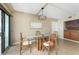 Bright dining area with modern light fixture and sliding glass door at 1750 Jamaica Way # 312, Punta Gorda, FL 33950