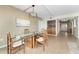 Bright dining area featuring a modern chandelier, and access to the entryway at 1750 Jamaica Way # 312, Punta Gorda, FL 33950