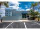 The building's facade features an inviting entrance with parking and landscaping at 1750 Jamaica Way # 312, Punta Gorda, FL 33950