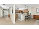 Open kitchen features a breakfast bar and pendant lighting, seamlessly connected to the living spaces at 1750 Jamaica Way # 312, Punta Gorda, FL 33950
