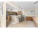 Bright kitchen boasts a breakfast bar with seating and seamless flow into the adjacent living area at 1750 Jamaica Way # 312, Punta Gorda, FL 33950