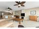 Comfortable living room featuring plush sofas, a fireplace, and an open layout with water views at 1750 Jamaica Way # 312, Punta Gorda, FL 33950