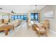 Open living and dining area with water views from the expansive windows at 1750 Jamaica Way # 312, Punta Gorda, FL 33950